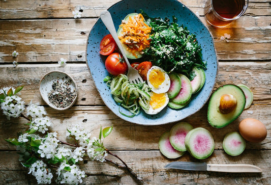 Gut-supportive wholefoods bowl with vegetables, eggs and avocado for skin health