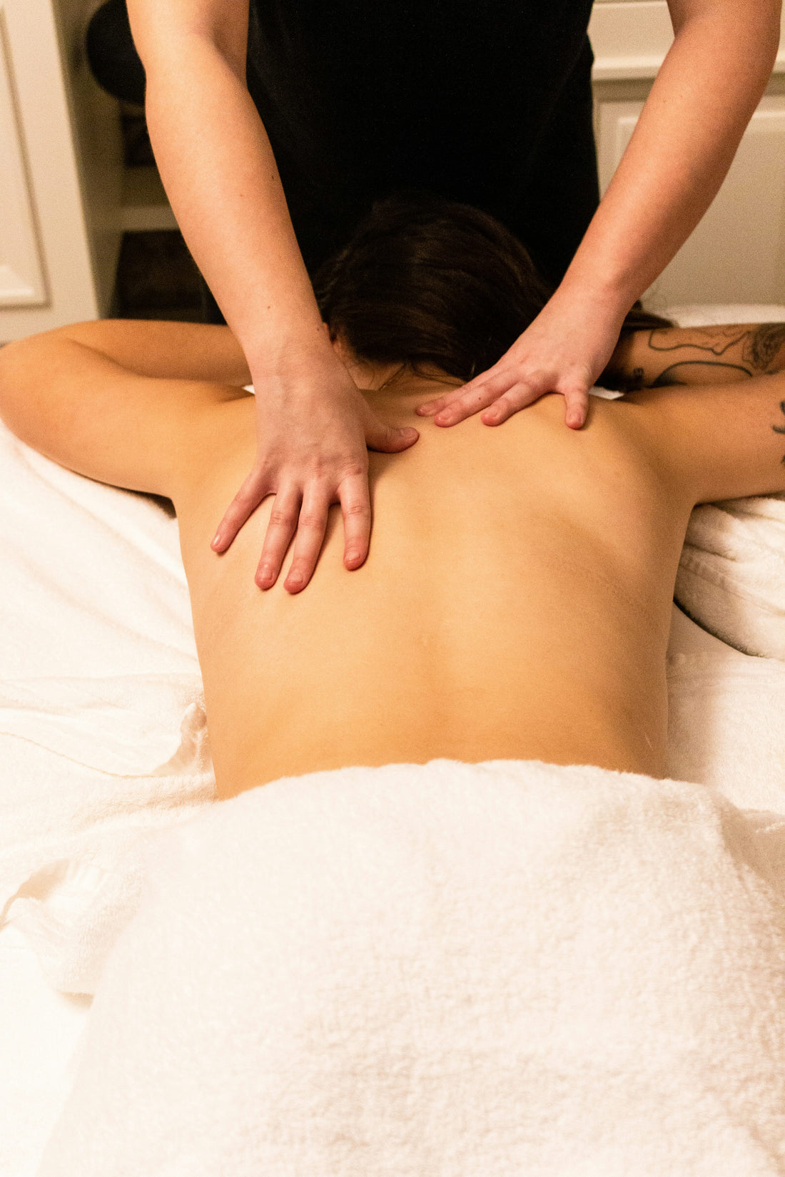 Woman receiving professional back massage at a spa