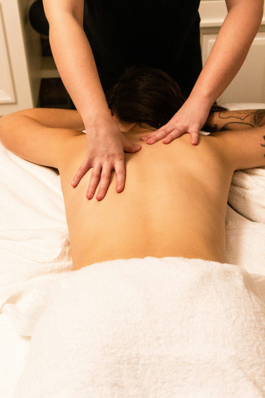 Woman receiving professional back massage at a spa