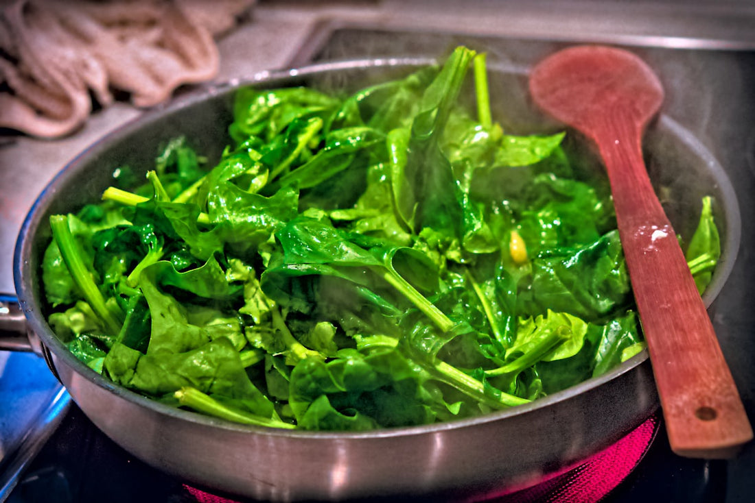 Pan of green leafy vegetables, a source of non-haem iron