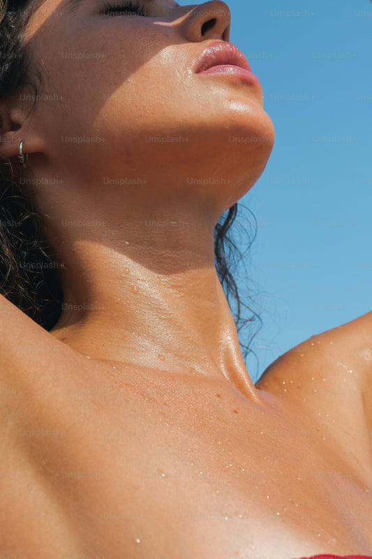 Woman over 35 applying summer skincare routine