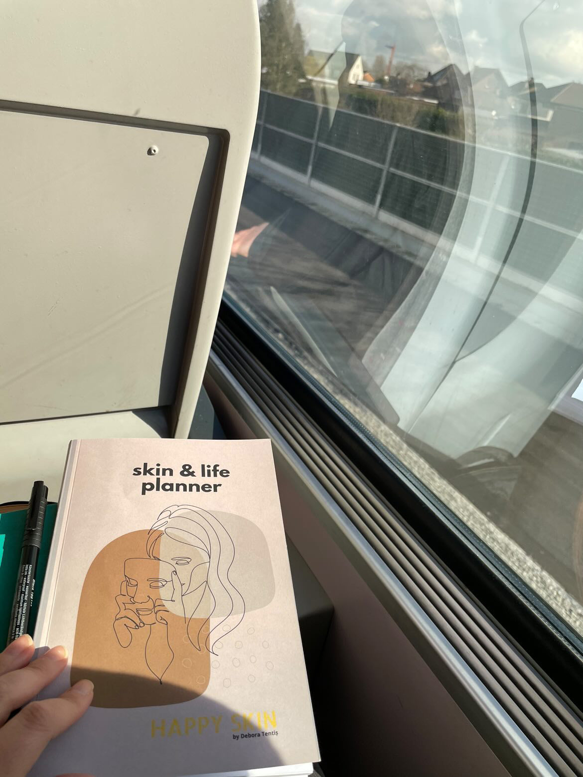 Skin and Life planner lifestyle flat lay with notebook