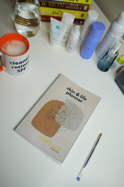 Skin and Life planner open showing daily skincare check-up